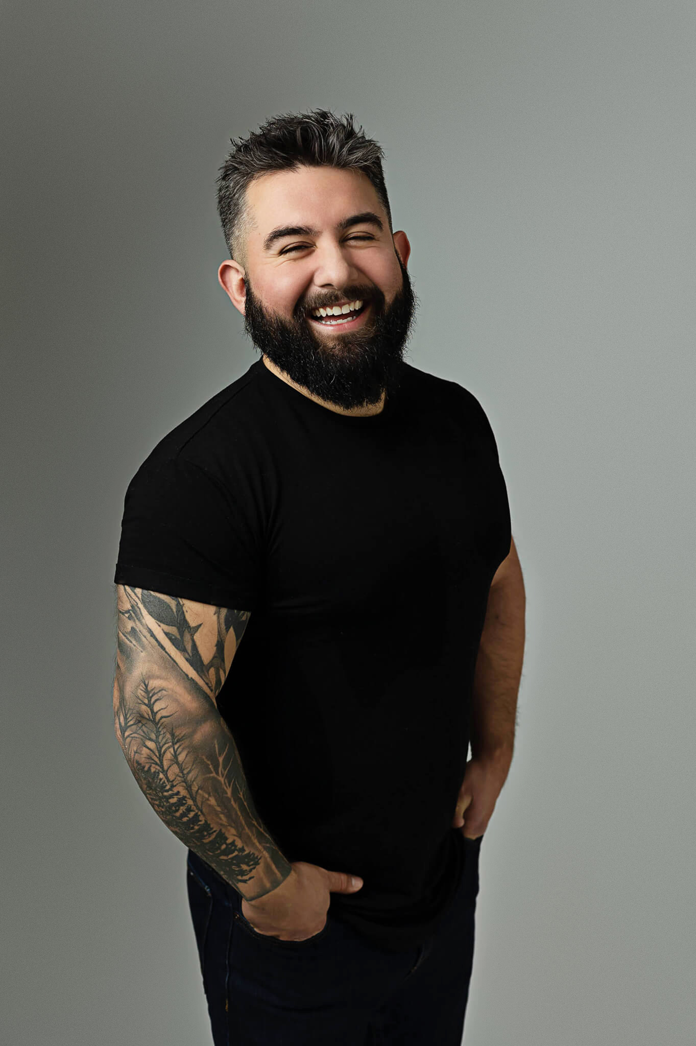 young professional in tech posing for his branding photoshoot as CEO of his own company