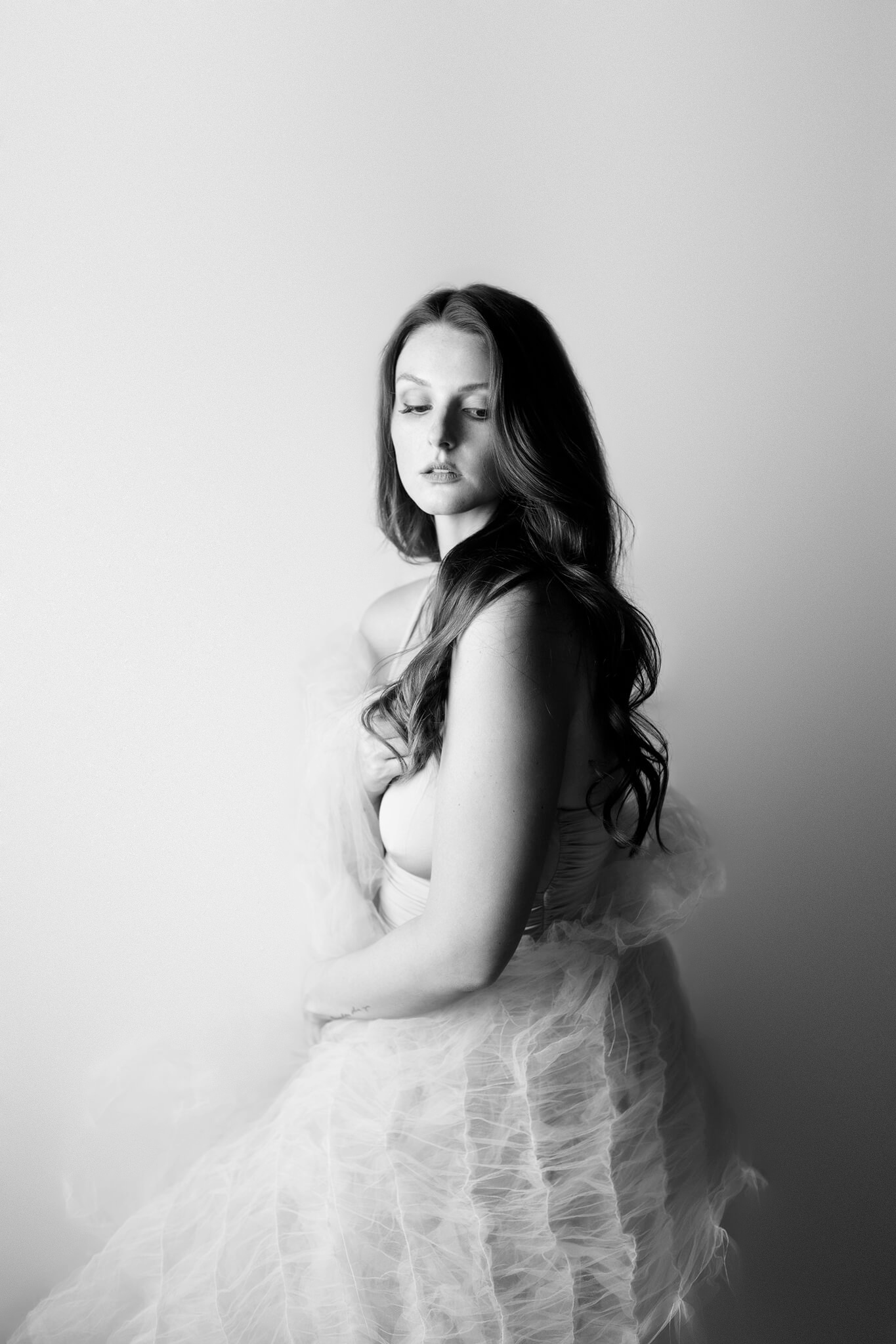 black and white elegant image of a young woman in a studio in texas