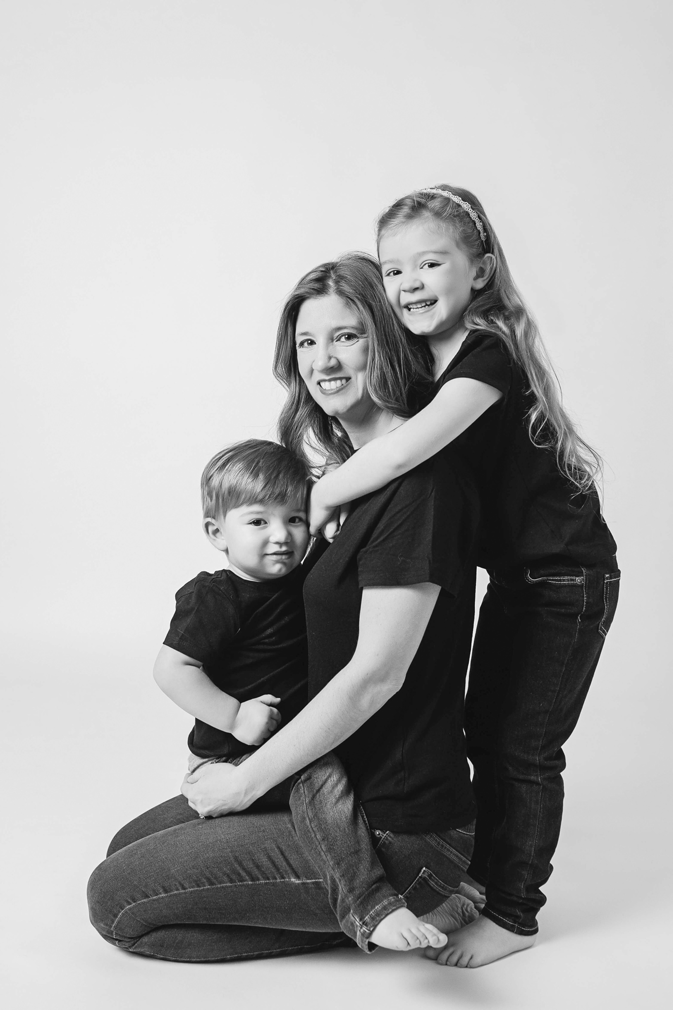 Mommy and me image of a mom and her two kids in a beautiful capture in black and white